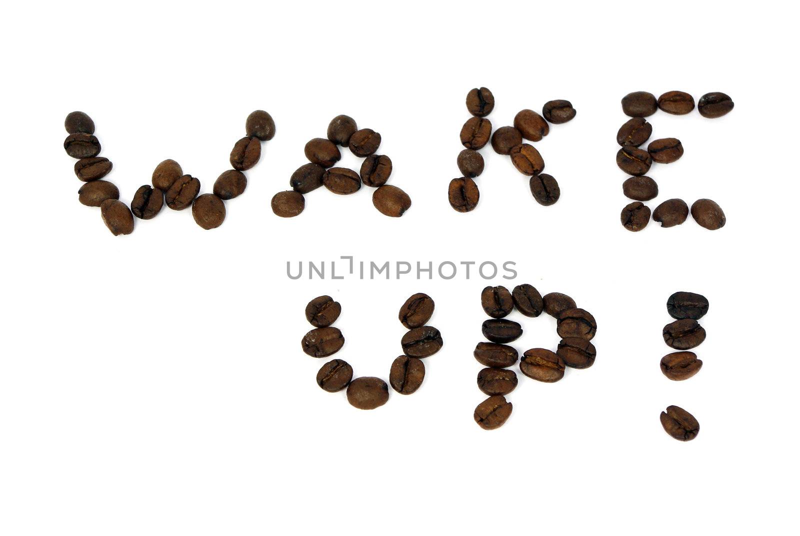 Phrase wake up written with coffee beans isolated on white