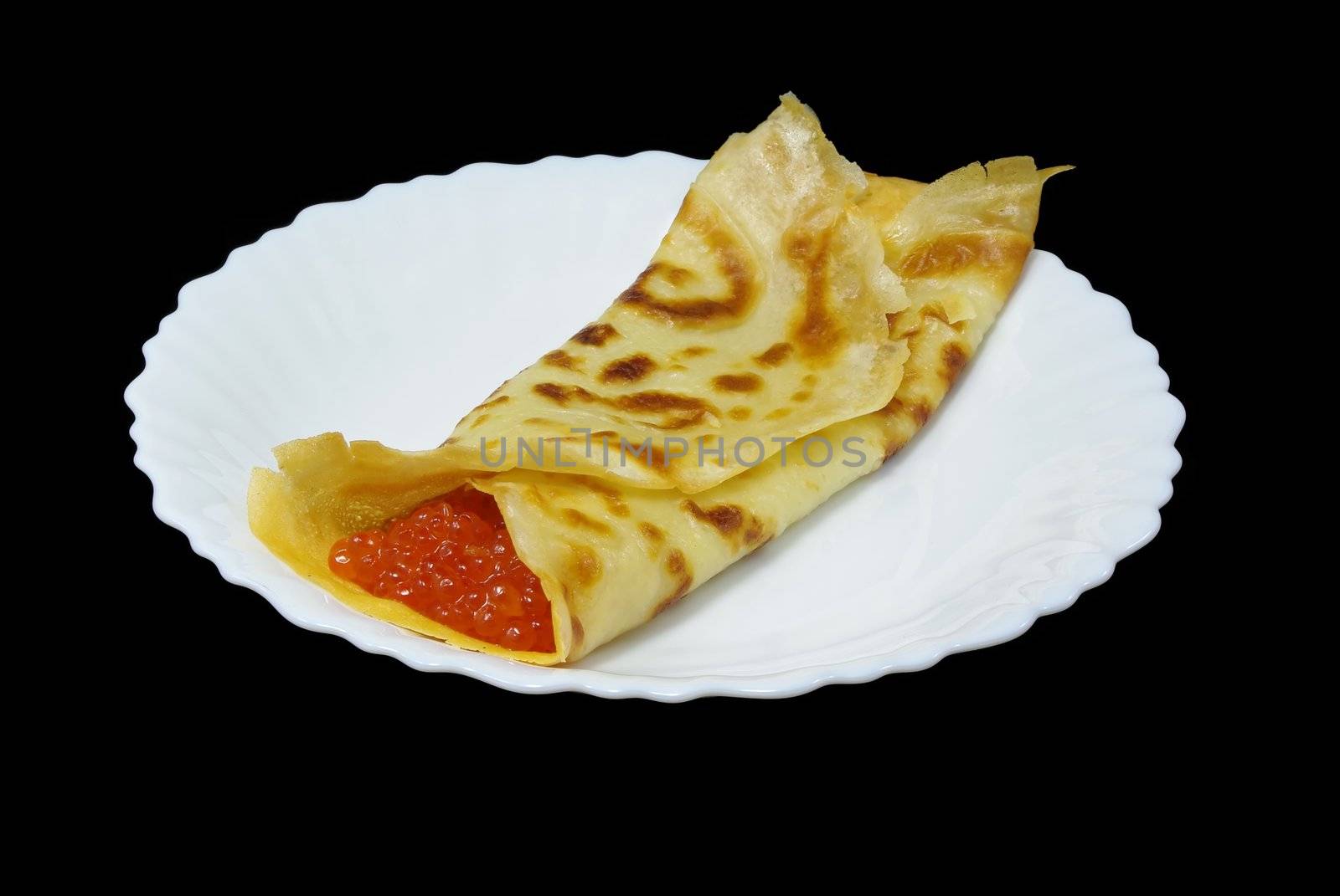 Traditional russian festal day delicacy pancake with caviar isolated on black background