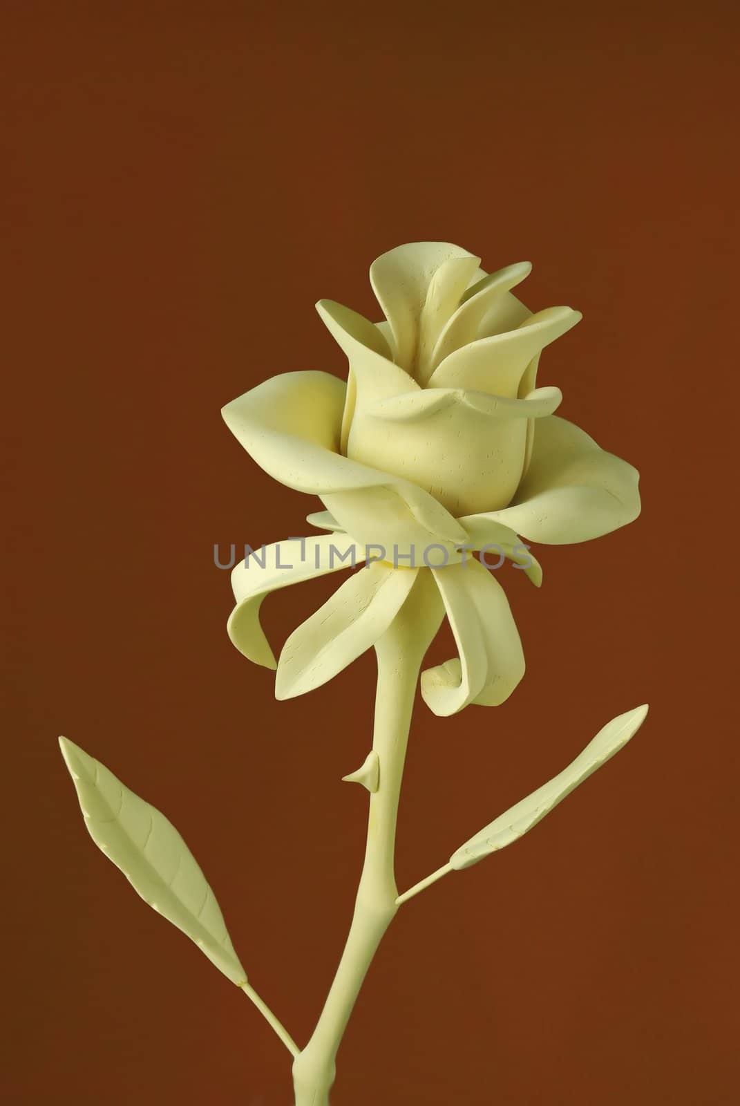 Handmade wooden rose flover on brown background