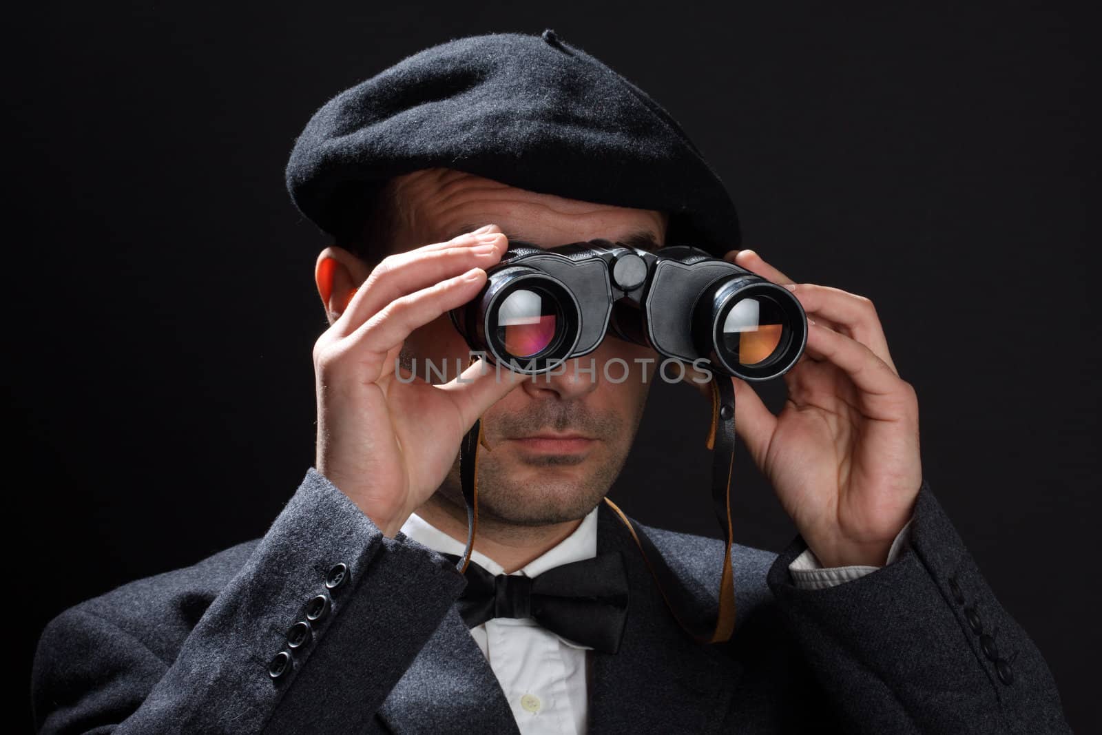 Old fashioned man look through the binoculars