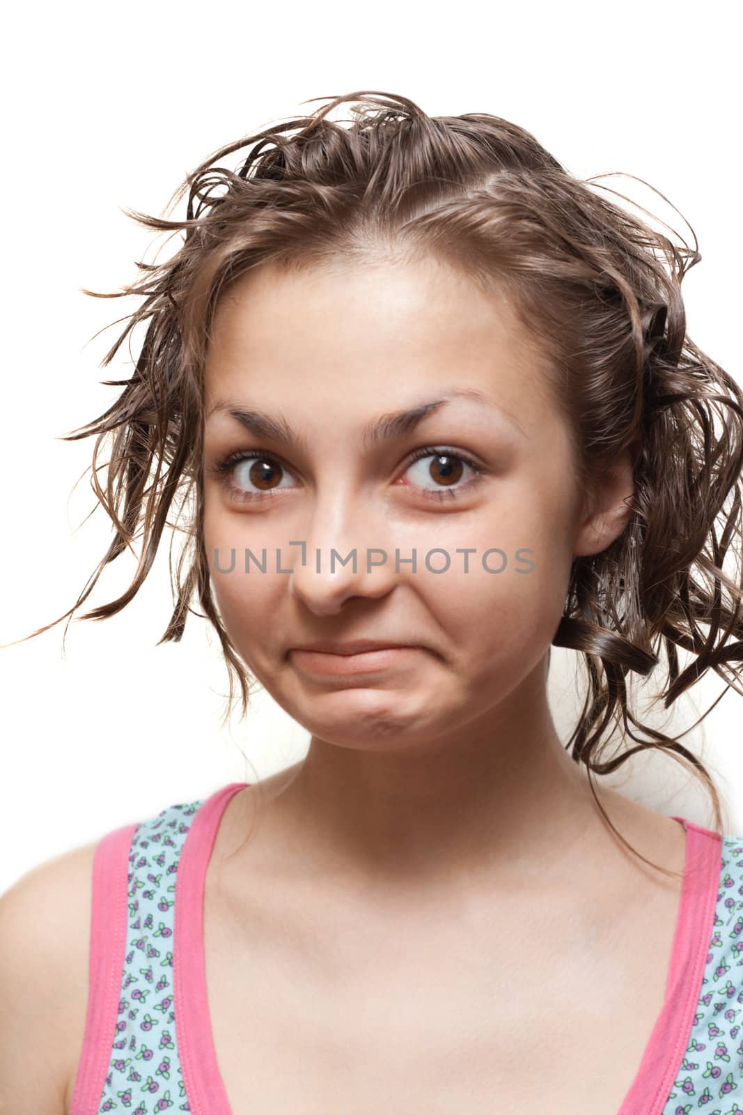 Young girl with wet hair and colour towel on neck, make faces