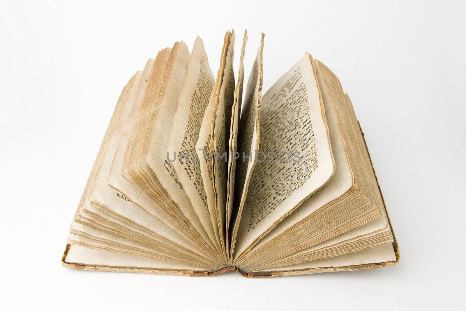 Open antique book on a white background