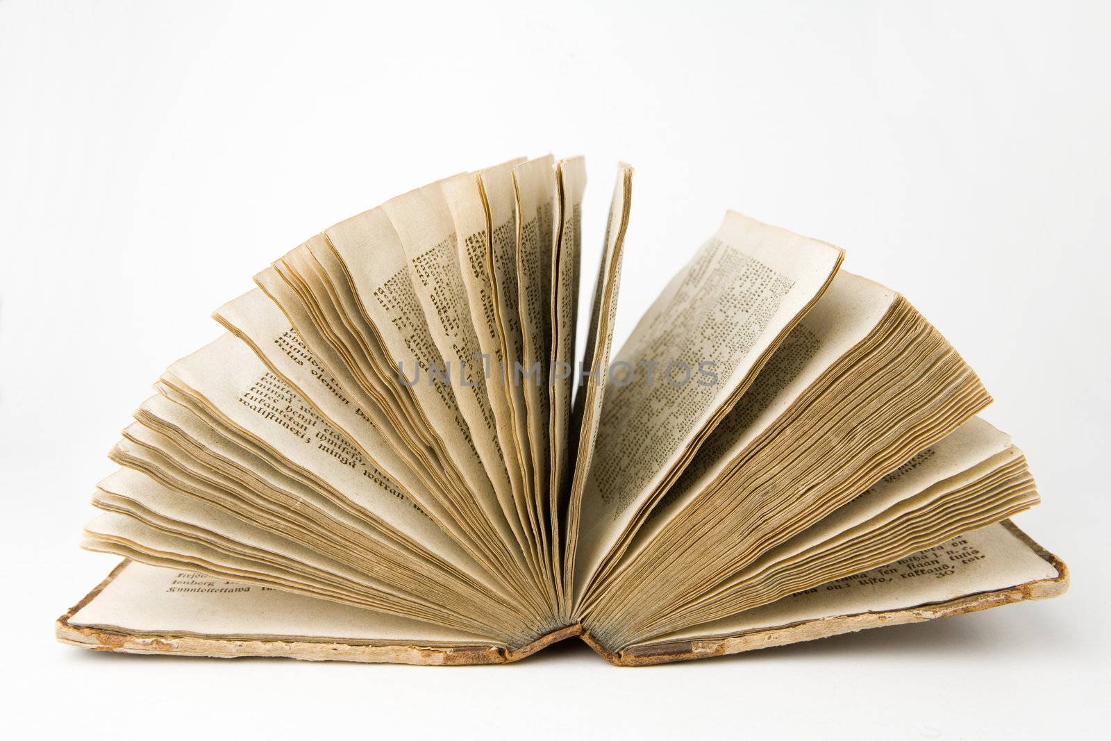 Open antique book on a white background