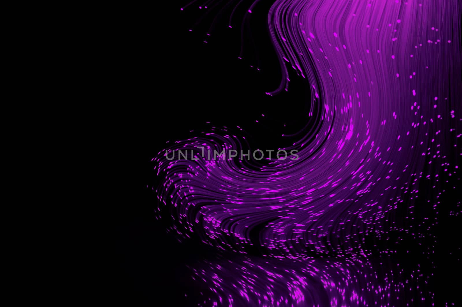 Mauve coloured fiber optic light strands swirling against a black background and reflecting into the foreground.