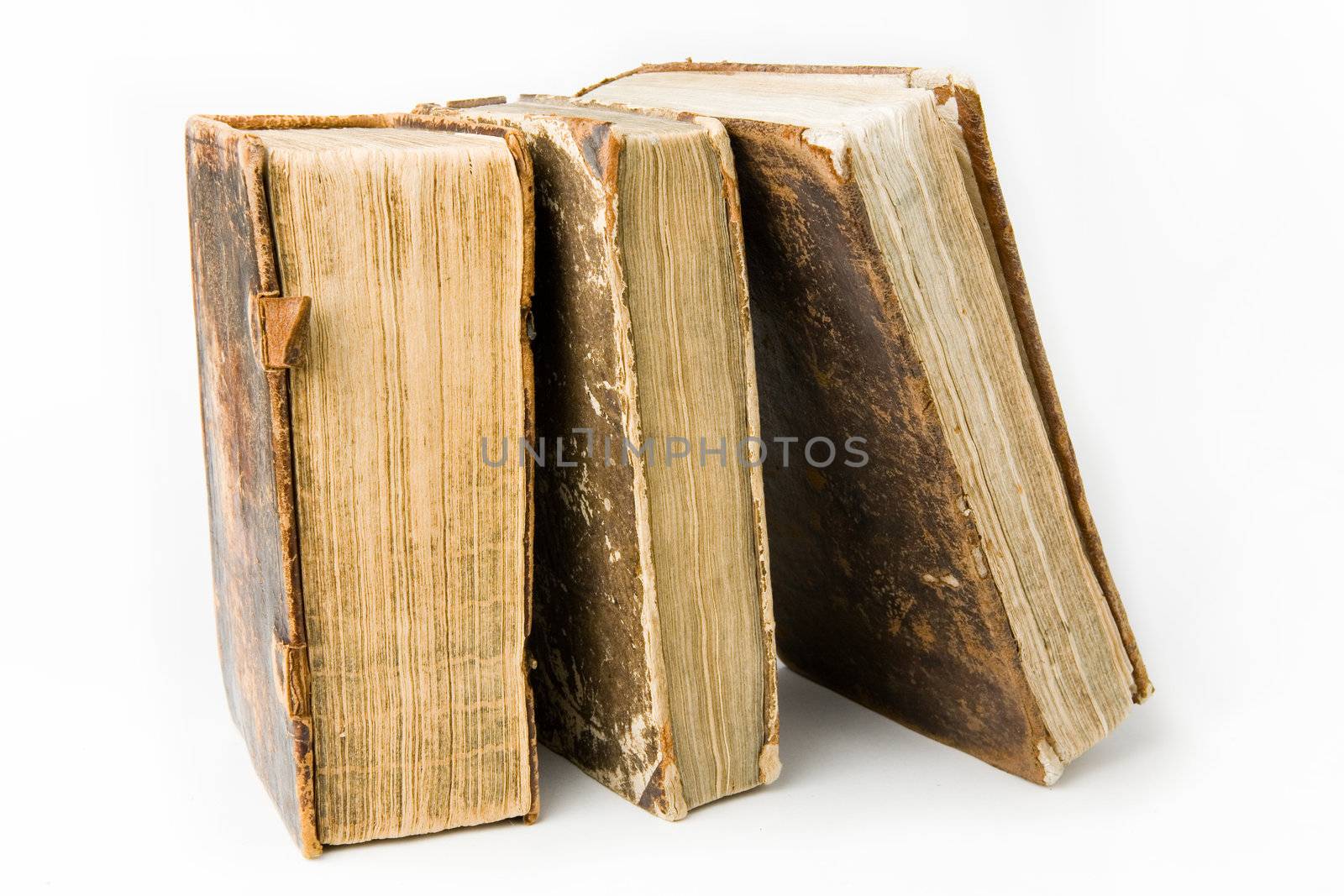 Row of antique books on a white background