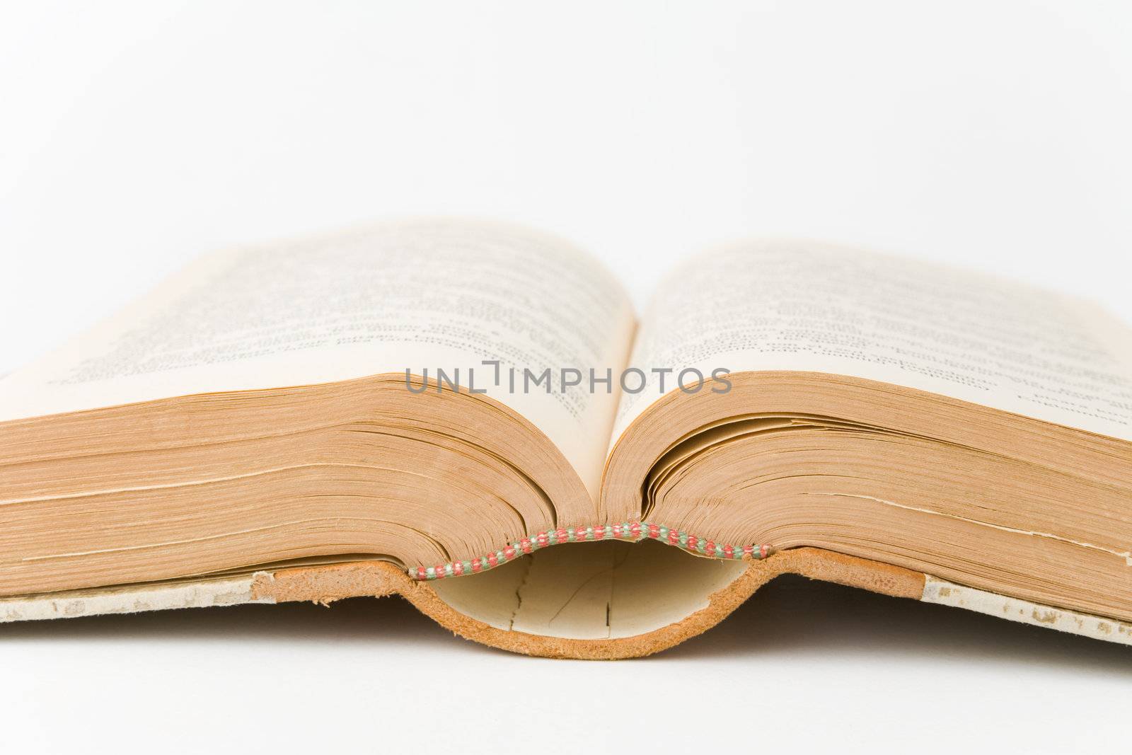 Old book open on a white background