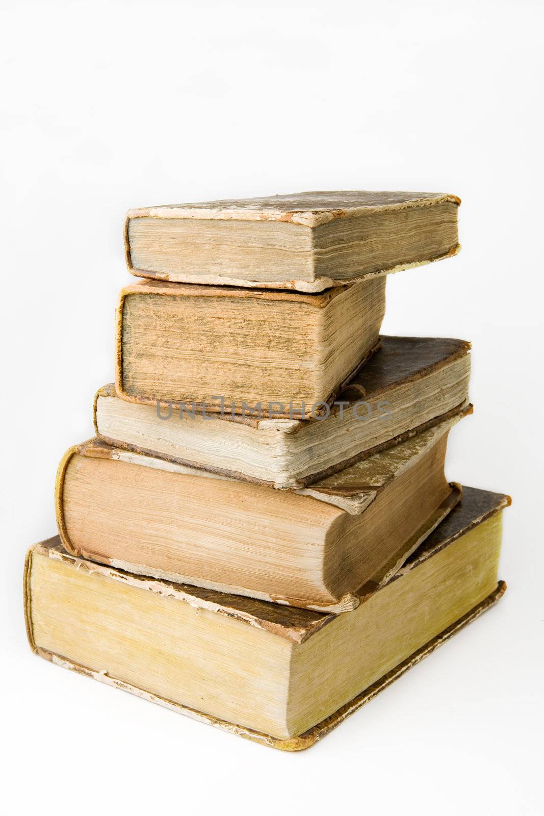 Pile of old books on white background