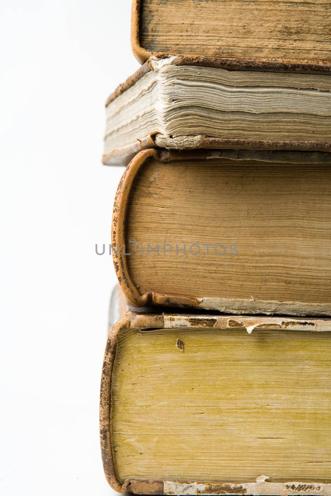 Pile of old books on white background