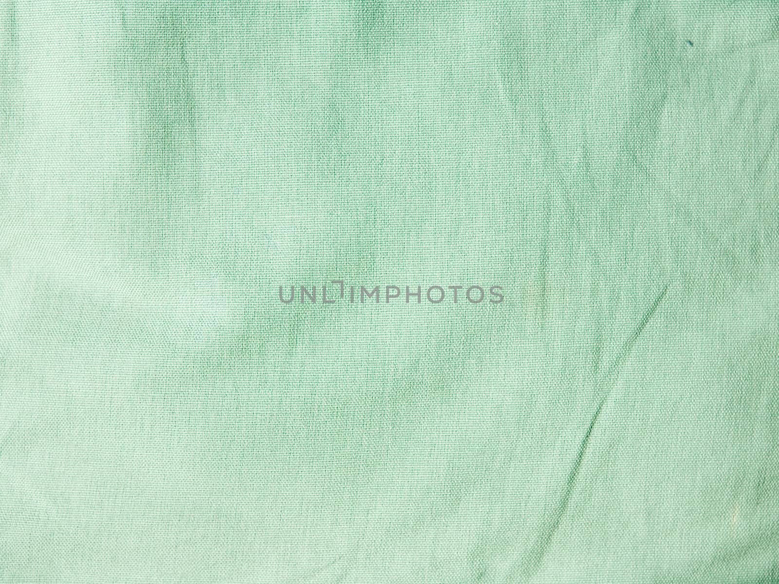 Green wrinkled fabric texture
