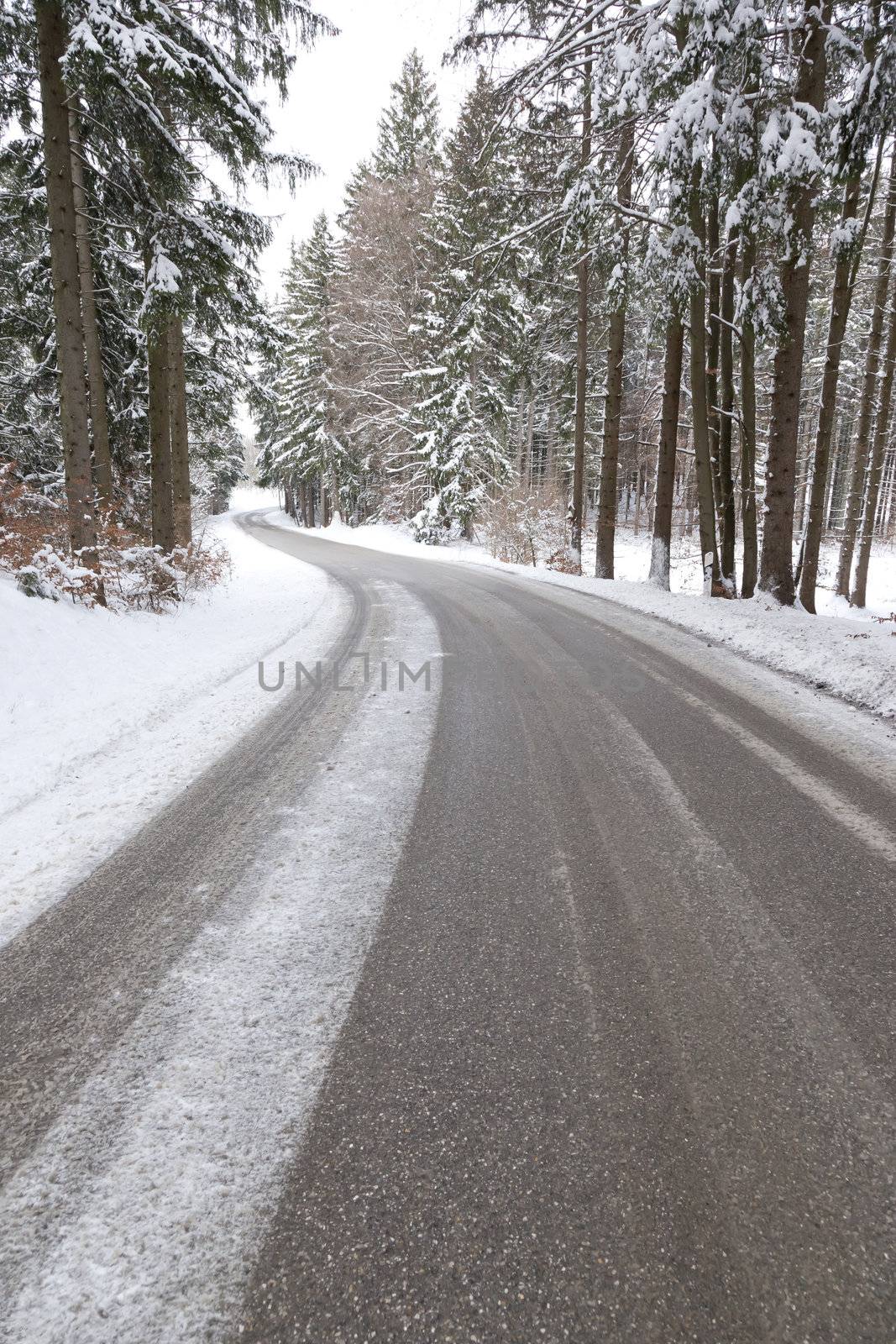 An image of a deep winter snowy road