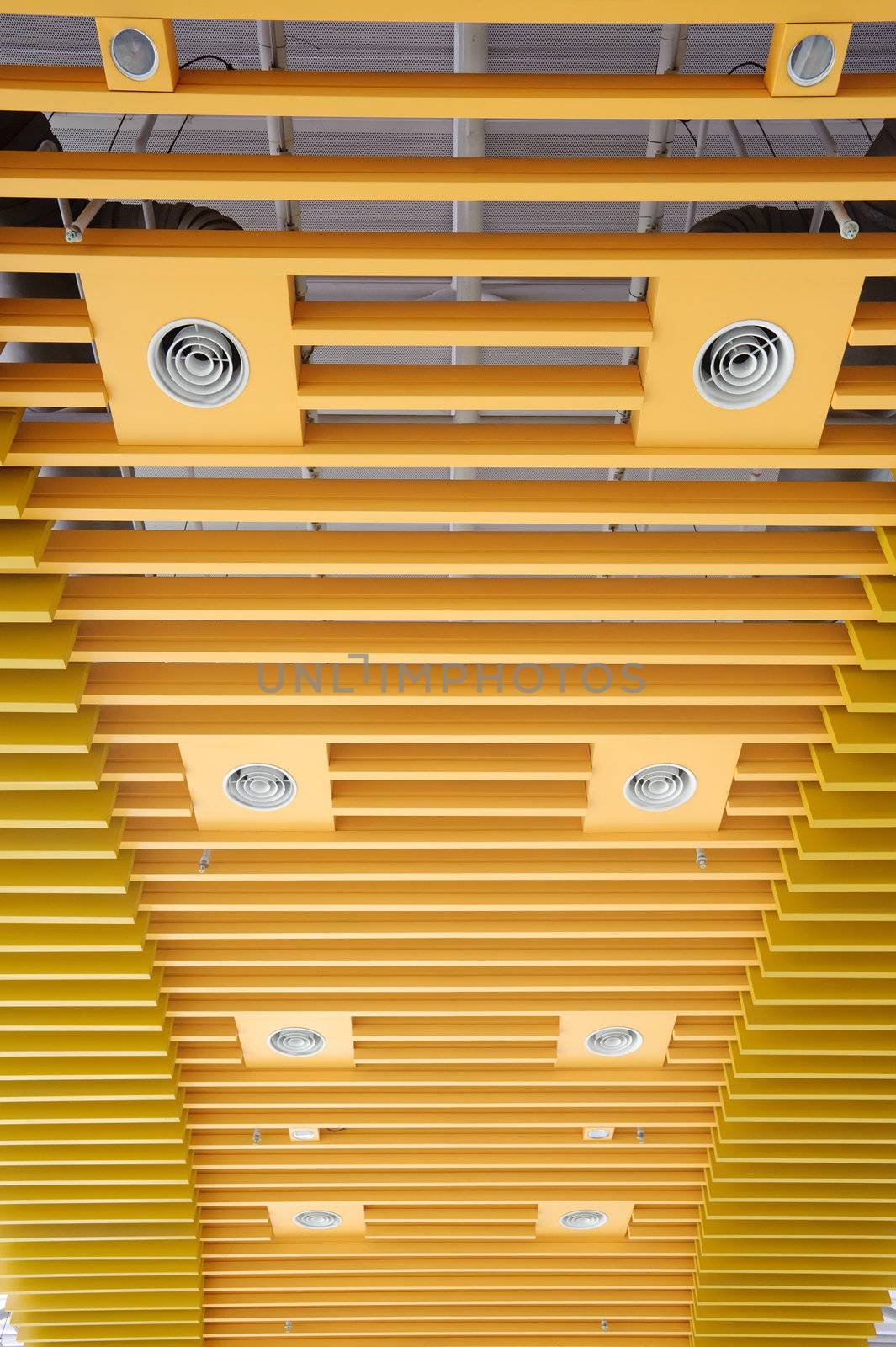 Abstract background of yellow ceiling of modern architecture.