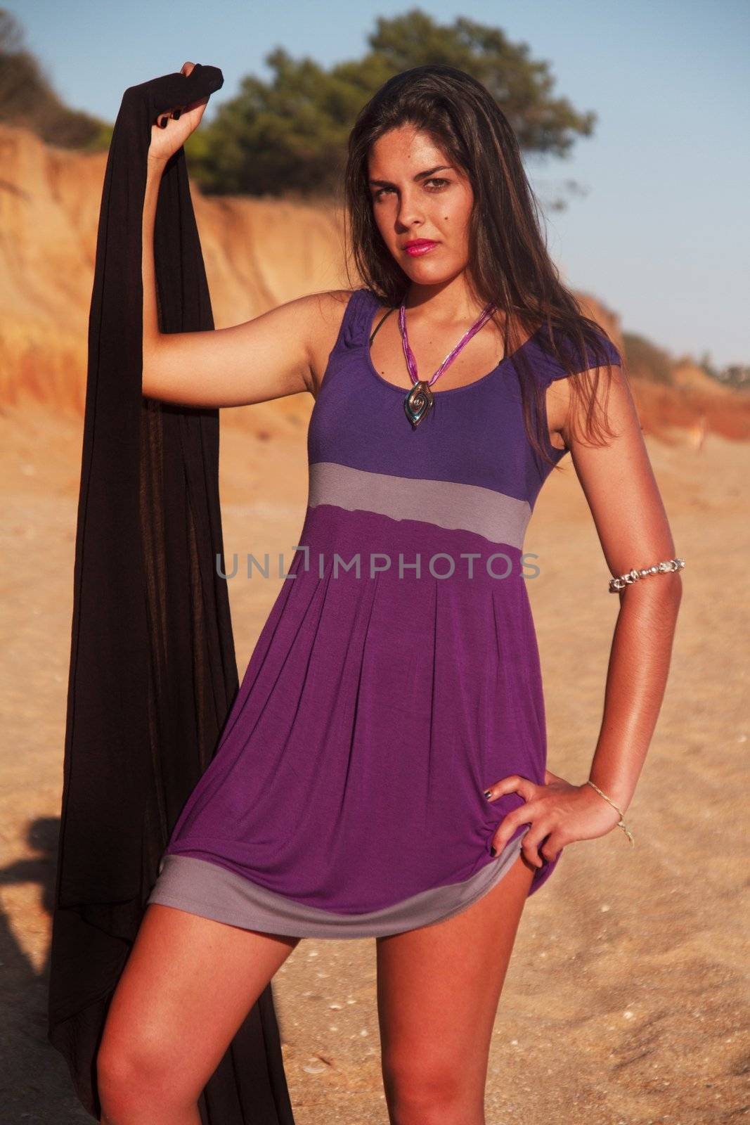 playful beautiful young girl with purple dress by membio