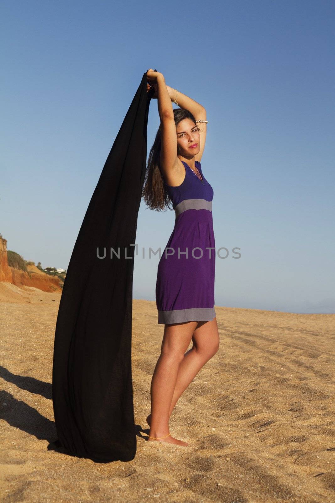 playful beautiful young girl with purple dress by membio