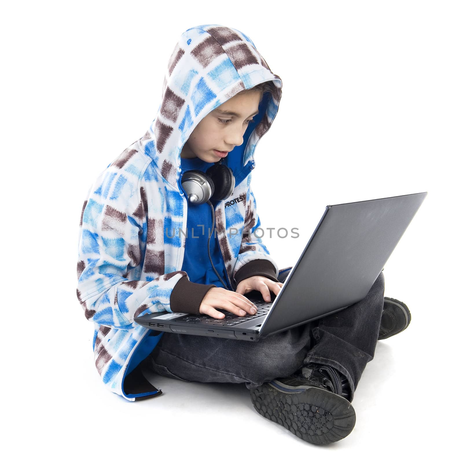 a boy with a laptop on a white background