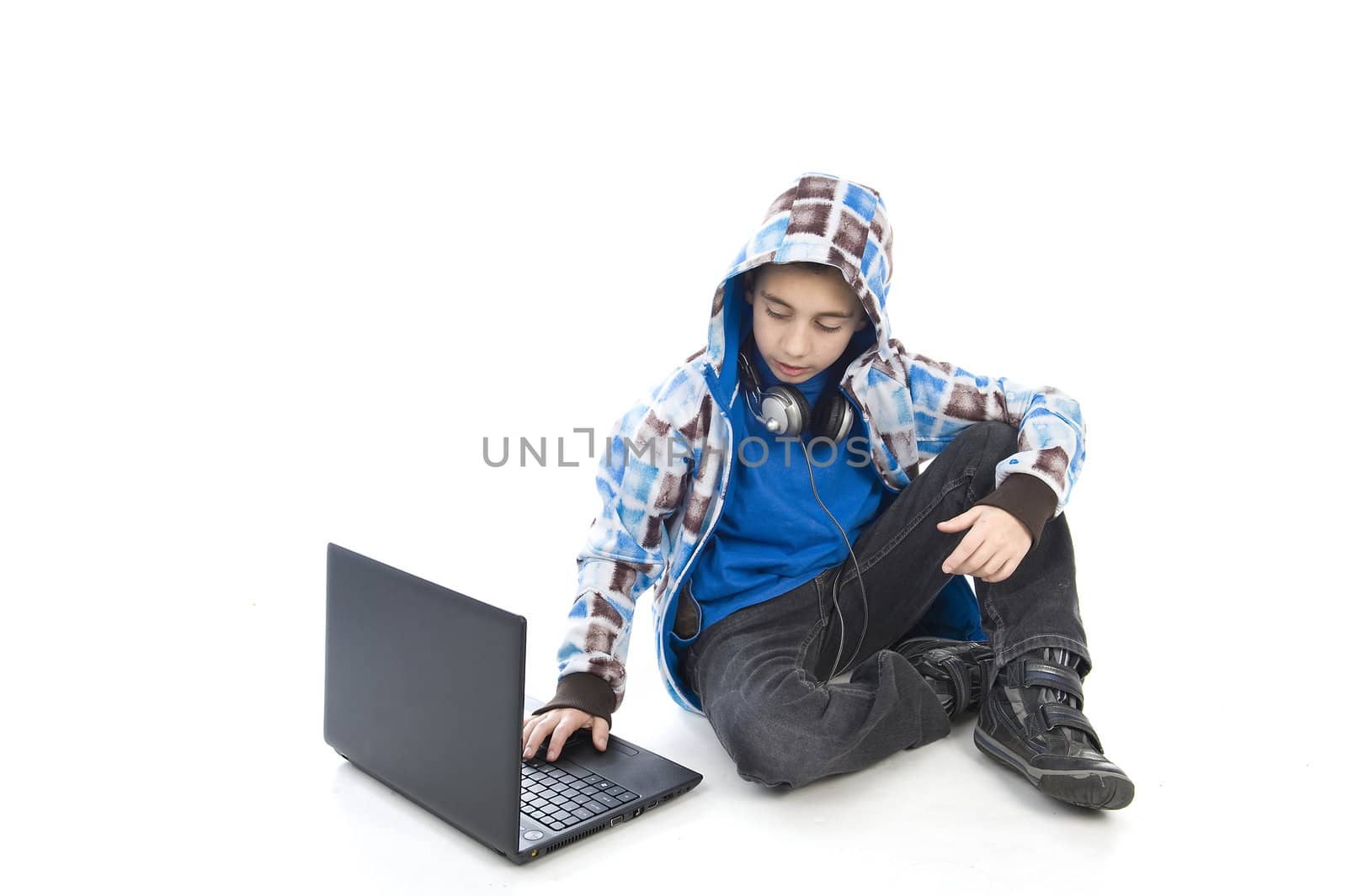 a boy with a laptop on a white background