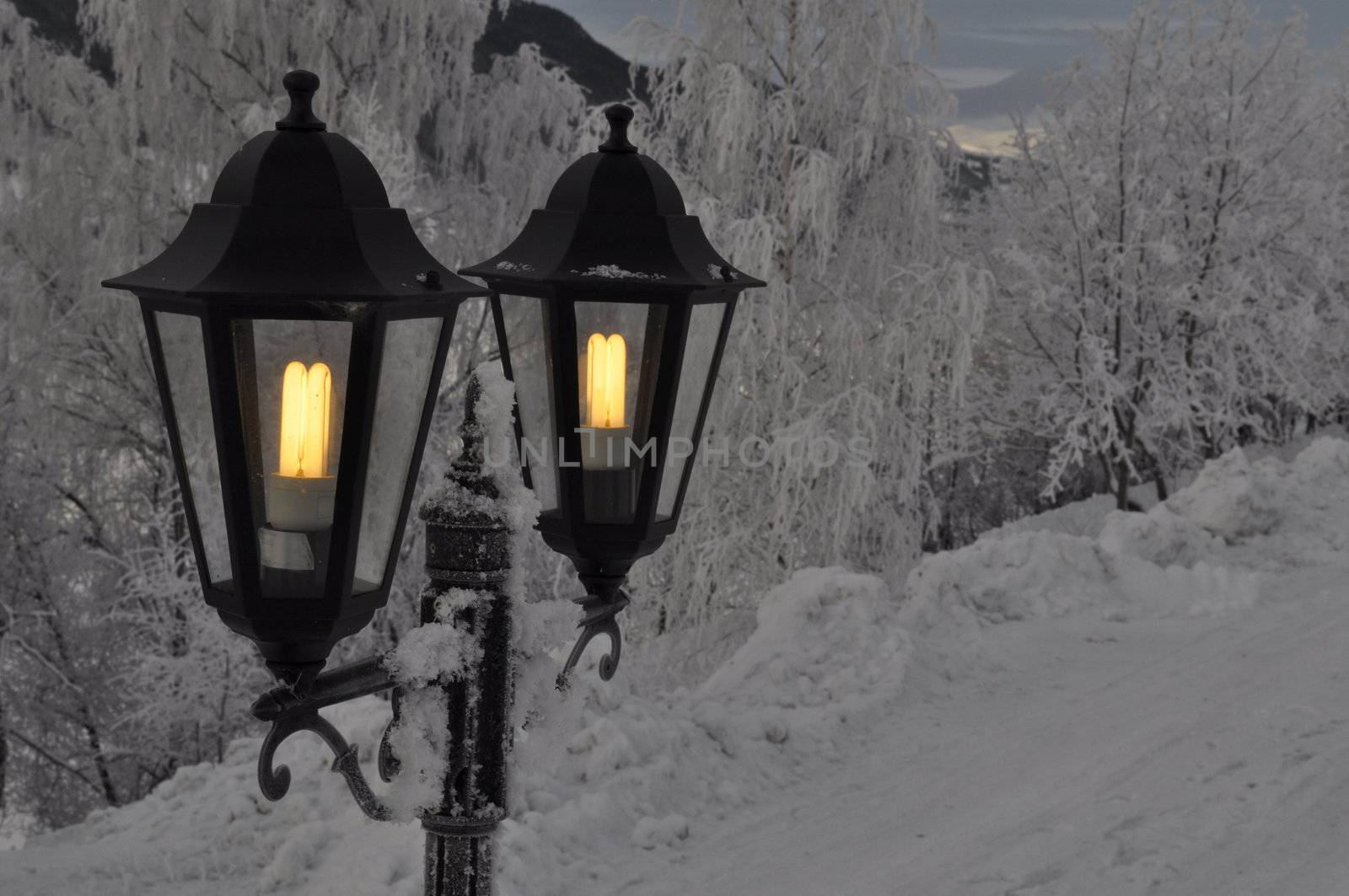 two outdoor lights in the winter