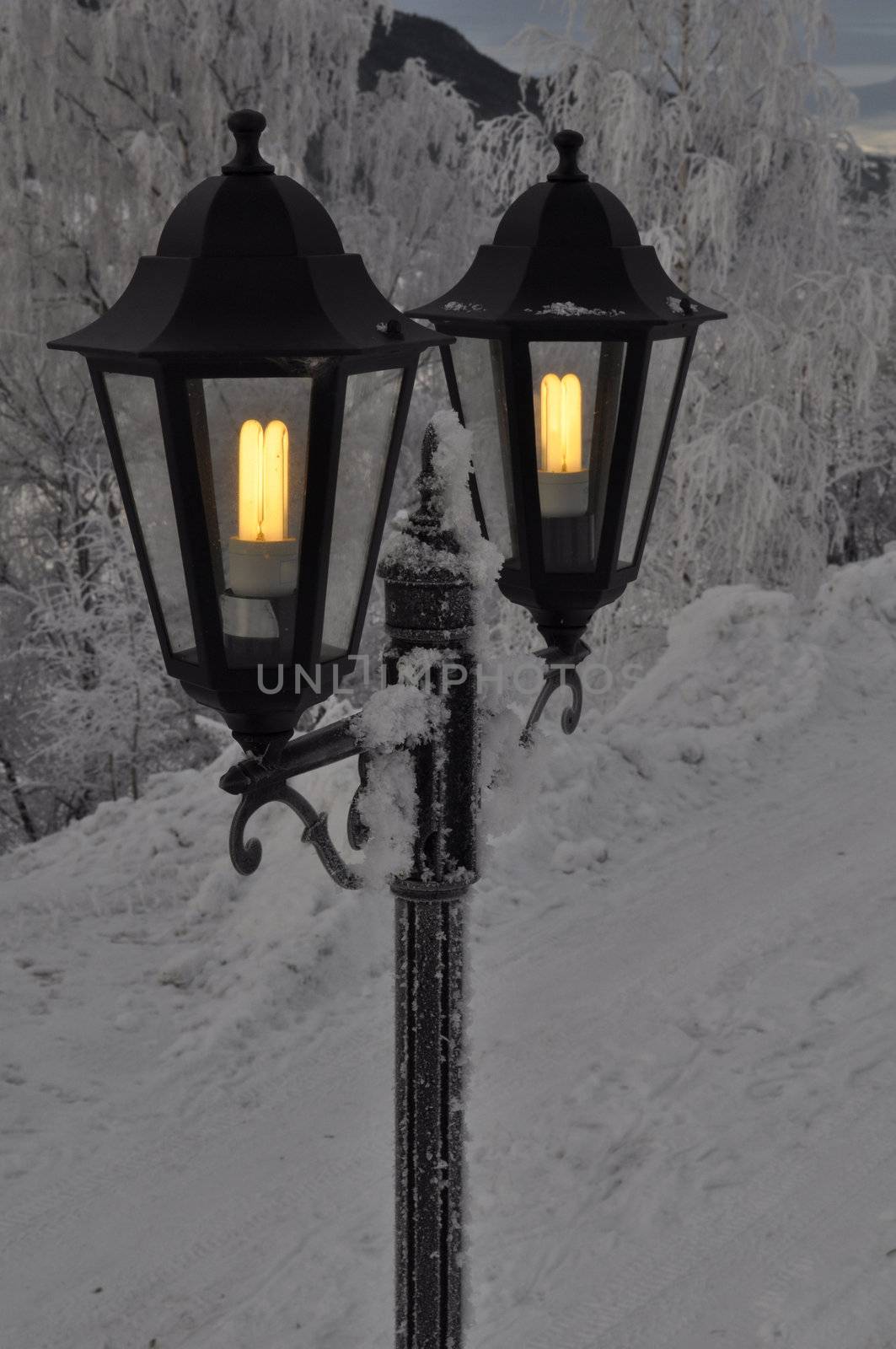 two outdoor lights in the winter