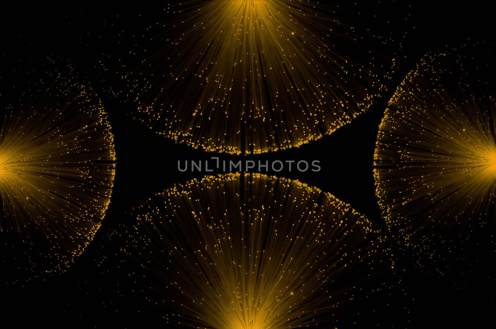 Four groups of illuminated golden fibre optic light strands eminating from each edge of the image against a black background.