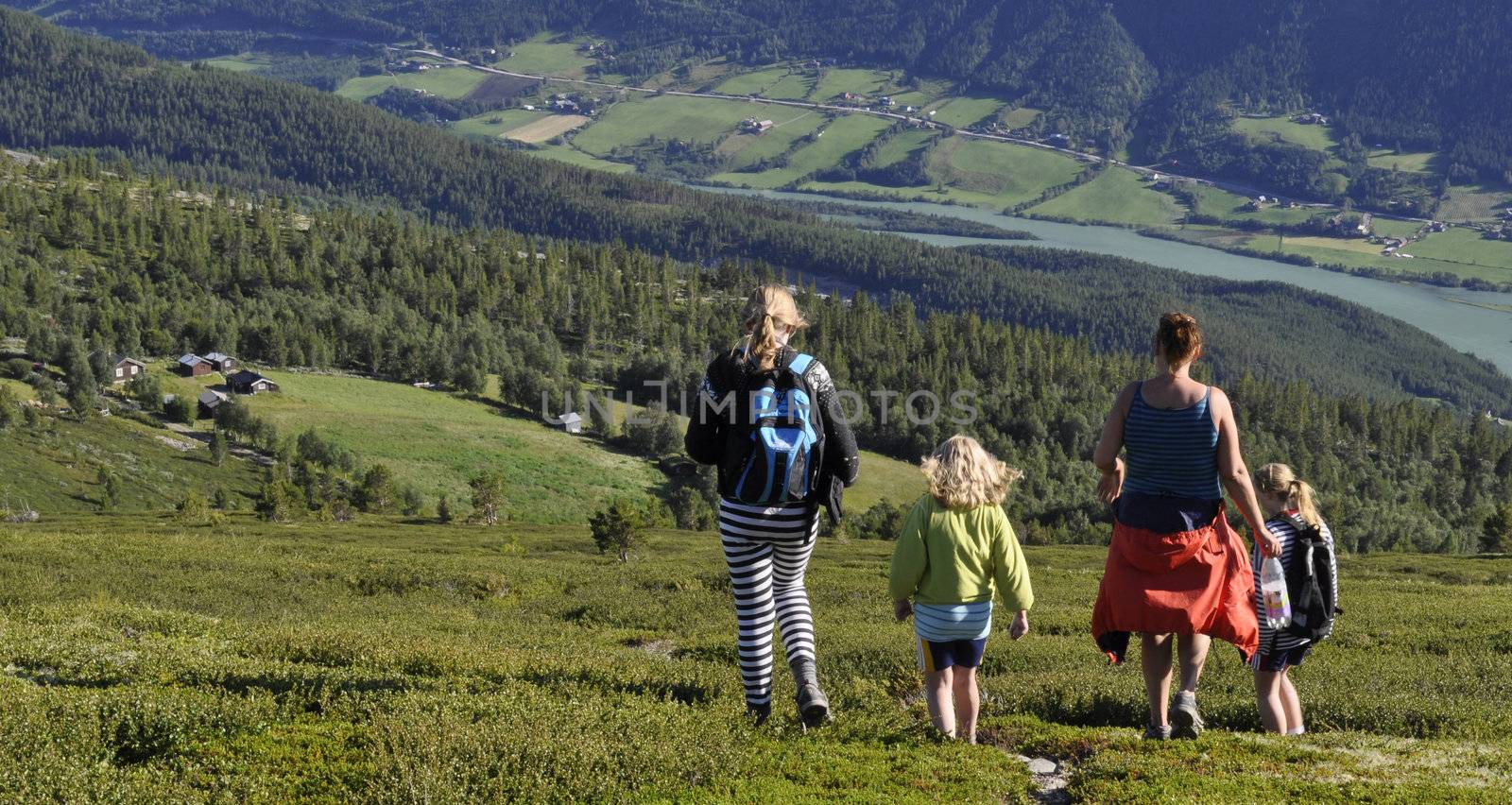 a group of people hiking in the mountains