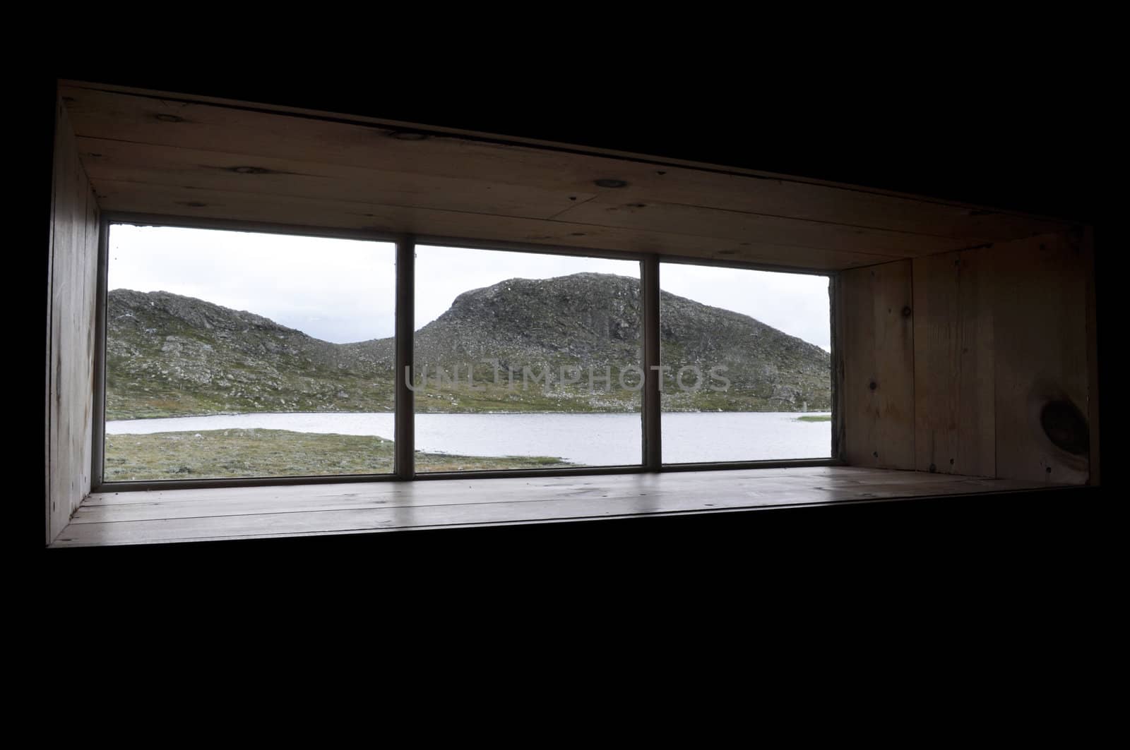 a view to mountainlake through a window