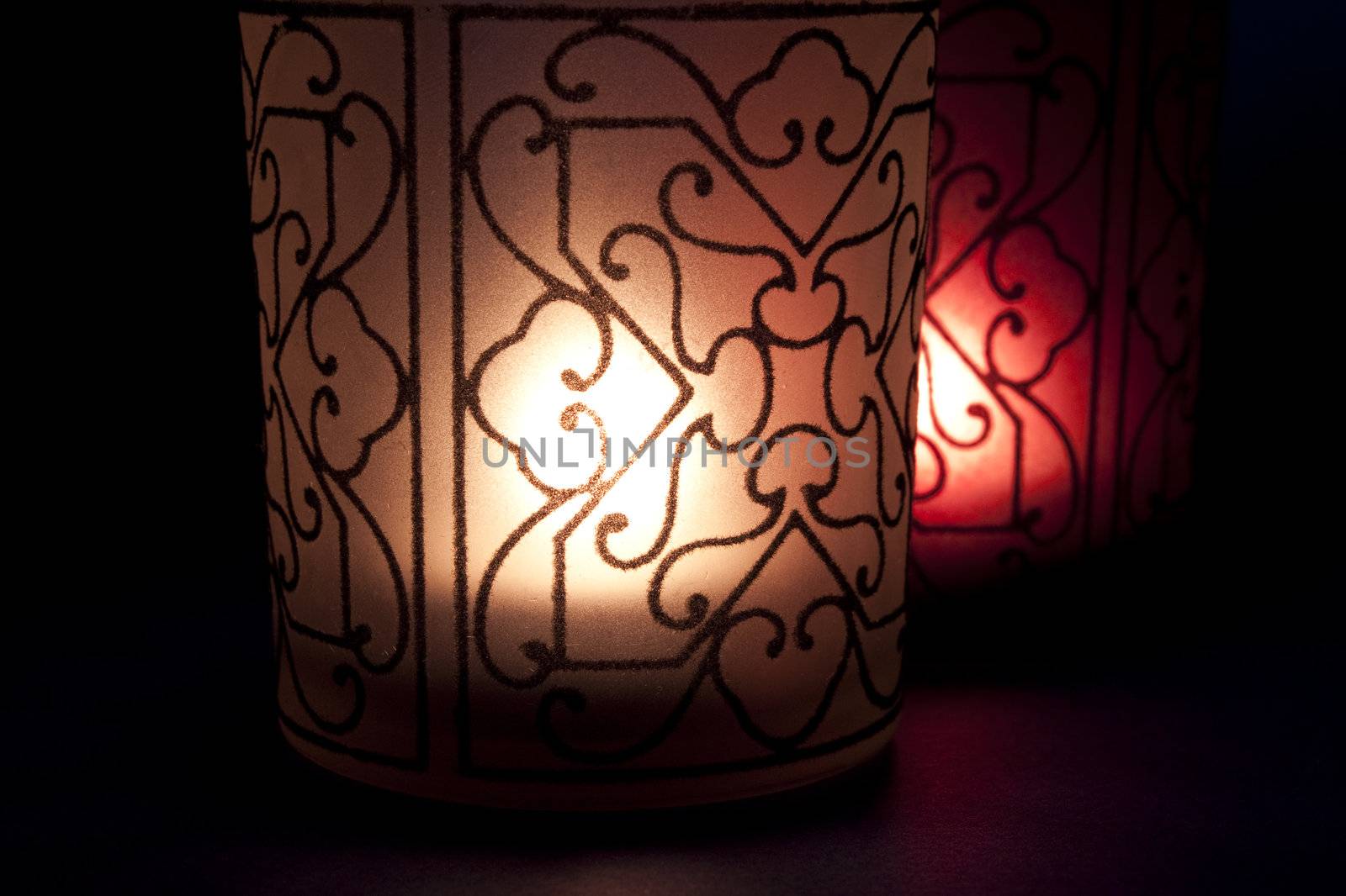 Stylized candles with light of hope in the darkness