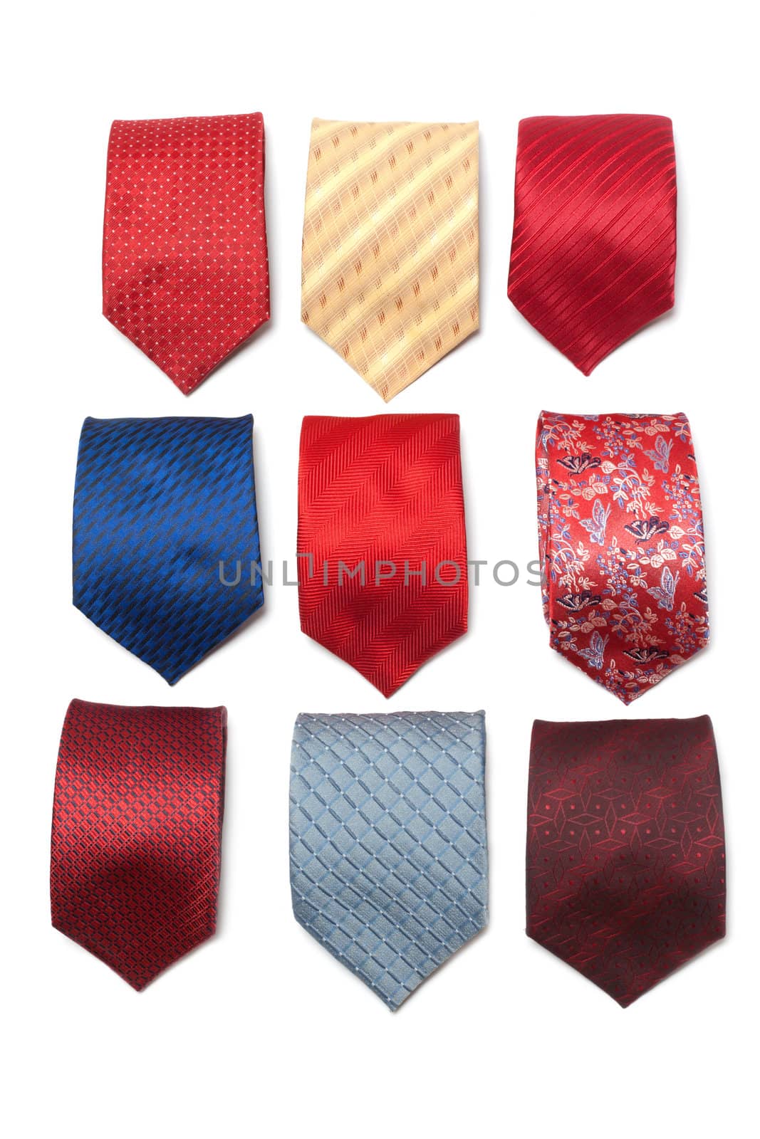 Varicoloured male ties convolute on white background