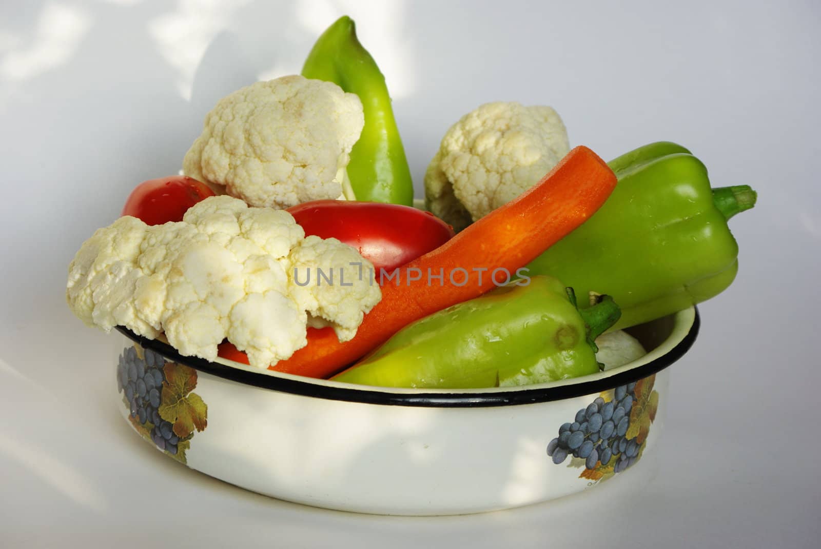 Bowl with fresh vegetables by Vitamin