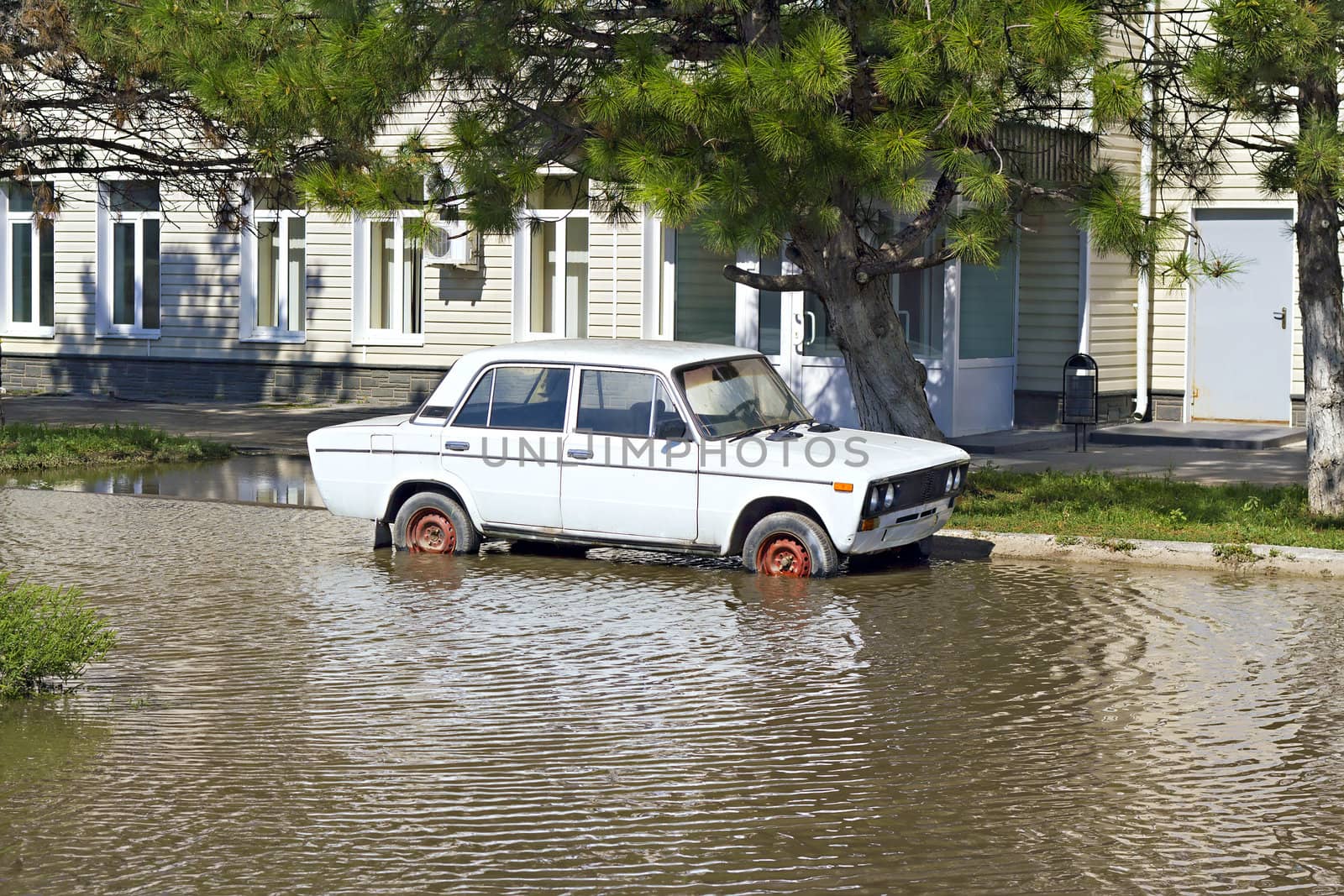 abandoned car in a deep pool near the building by Plus69