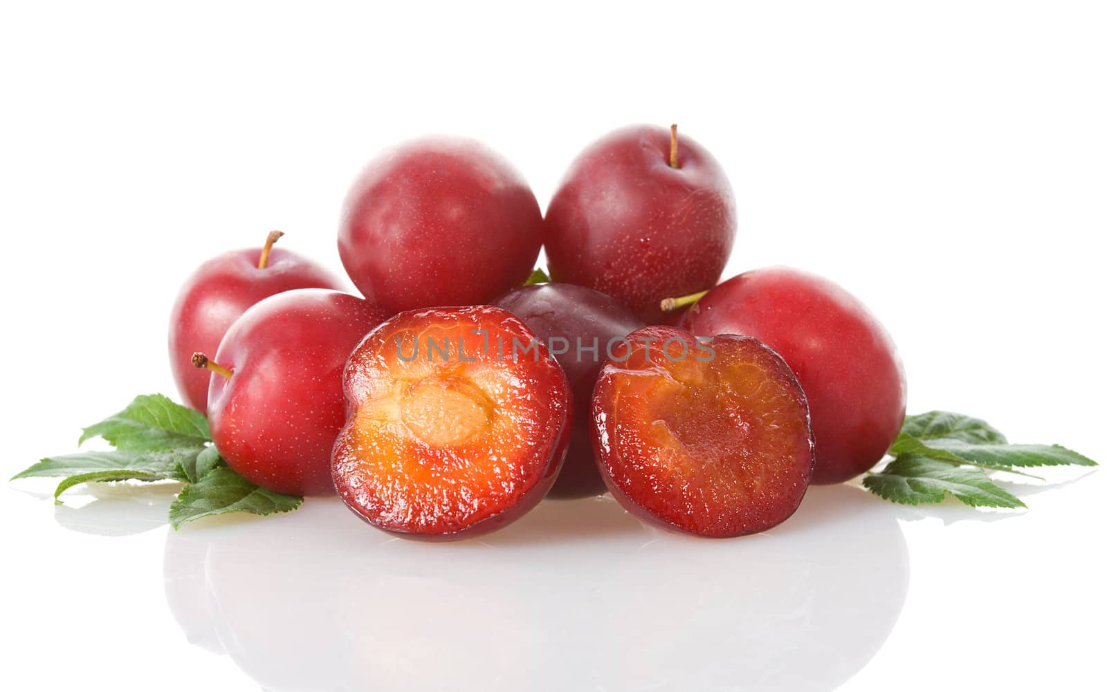 heap of red plums, isolated on white