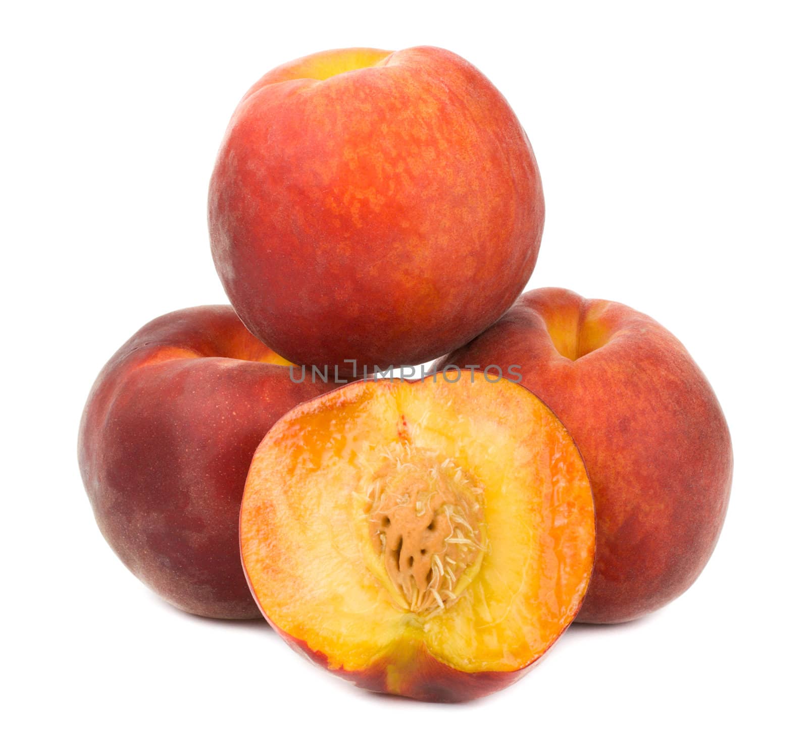 close-up heap of ripe peaches, isolated on white