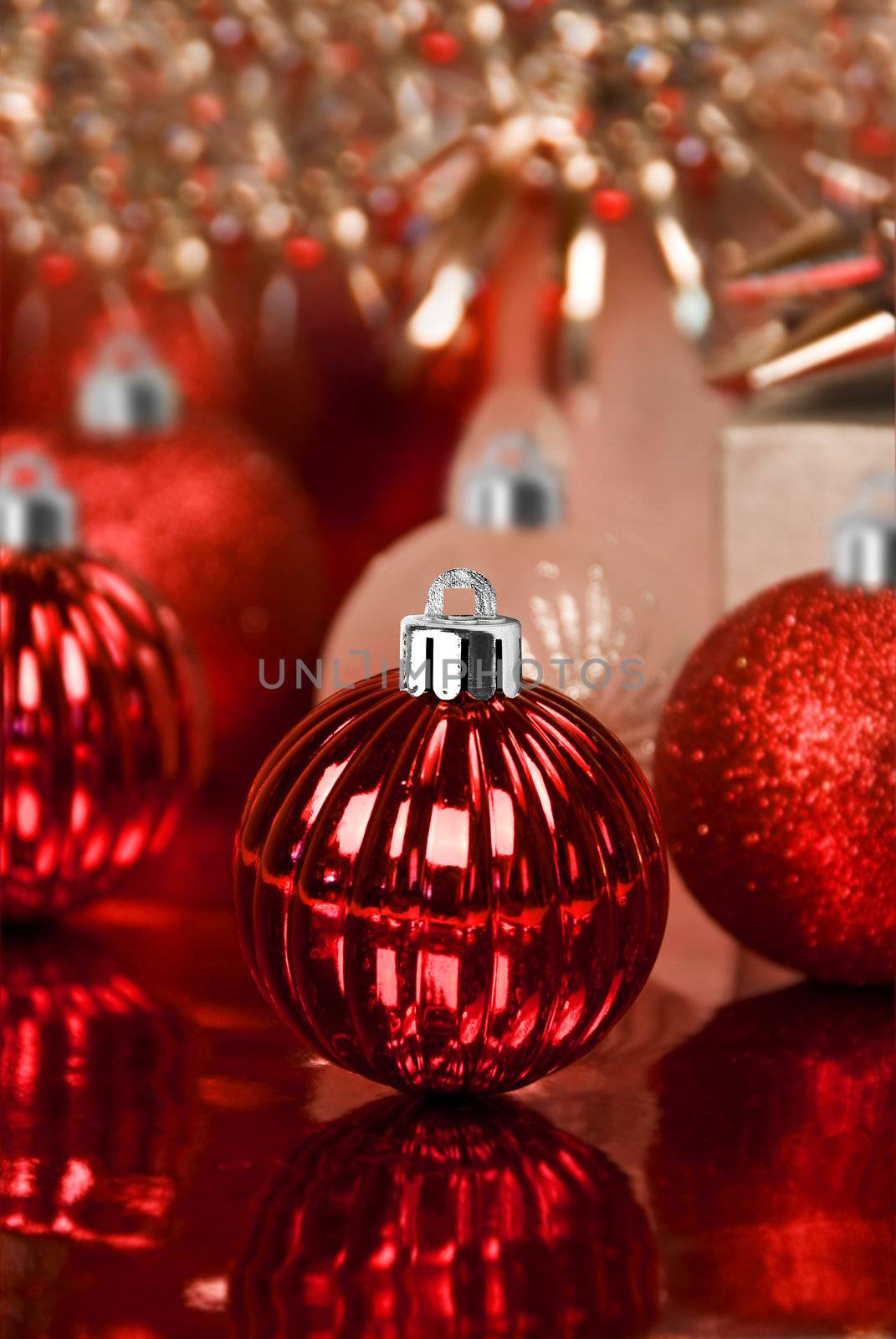 Red christmas ornaments with star background by tish1