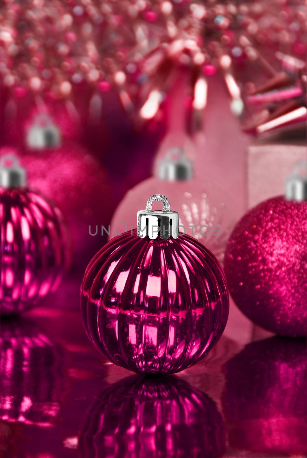 Pink christmas ornaments with star background by tish1