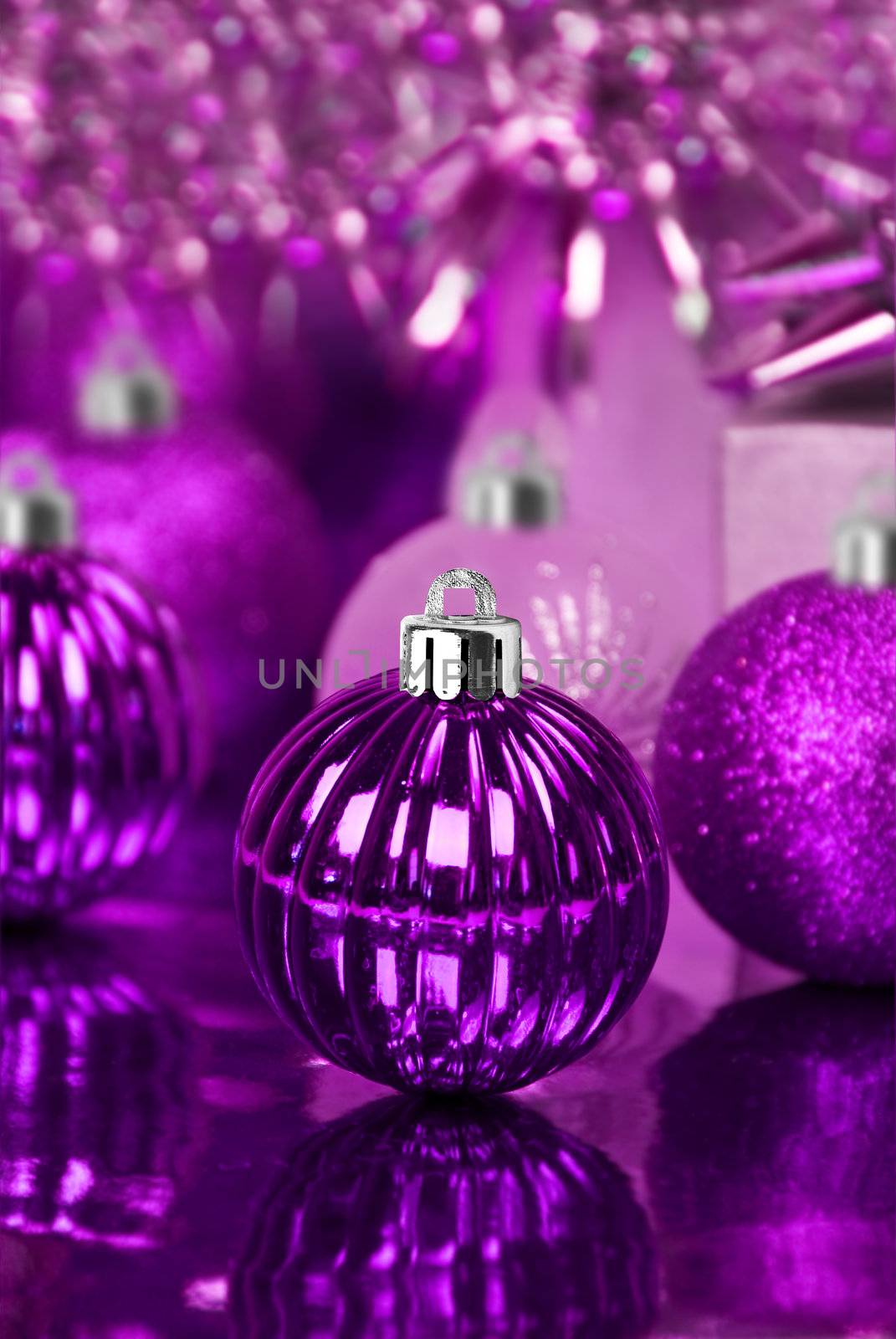 Purple christmas ornaments with star background