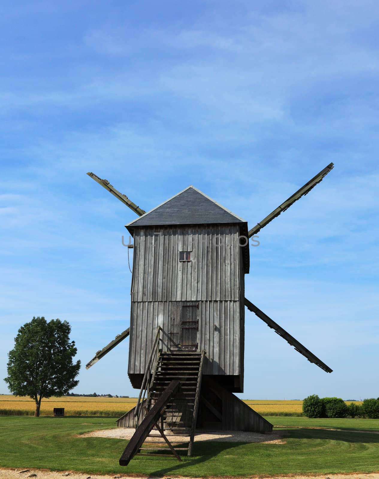 Back part of a traditional wooden windmill in France in the Eure &Loir Valley region.This is "The big windmill from Ouarville".