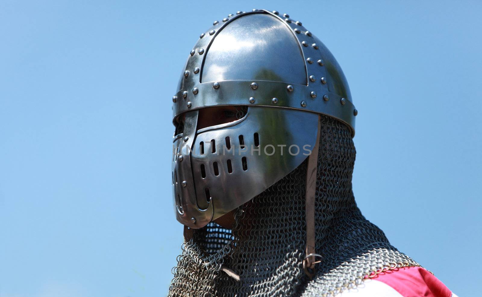 Image of a templar knight helmet against a blue sky.Natural lighting.