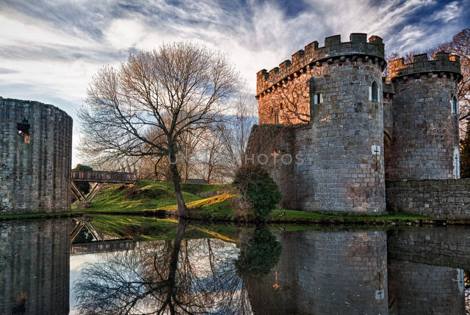 Whittington Castle in Shropshire reflecting on moat by steheap