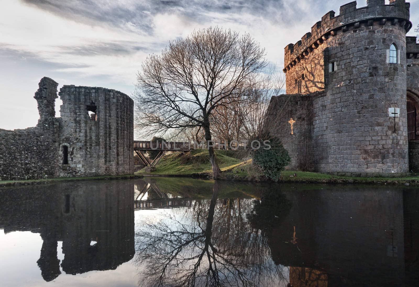 Whittington Castle in Shropshire reflecting on moat by steheap