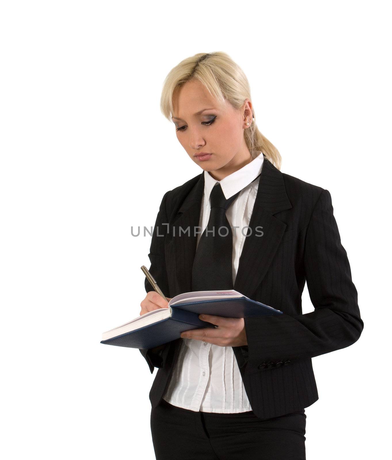 Businesswoman takes notes in a diary against white background.