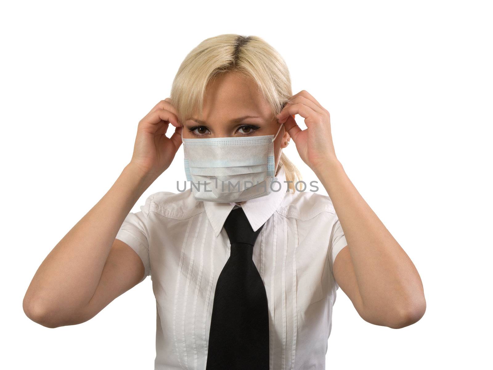 Blonde girl wearing surgical mask against white background.