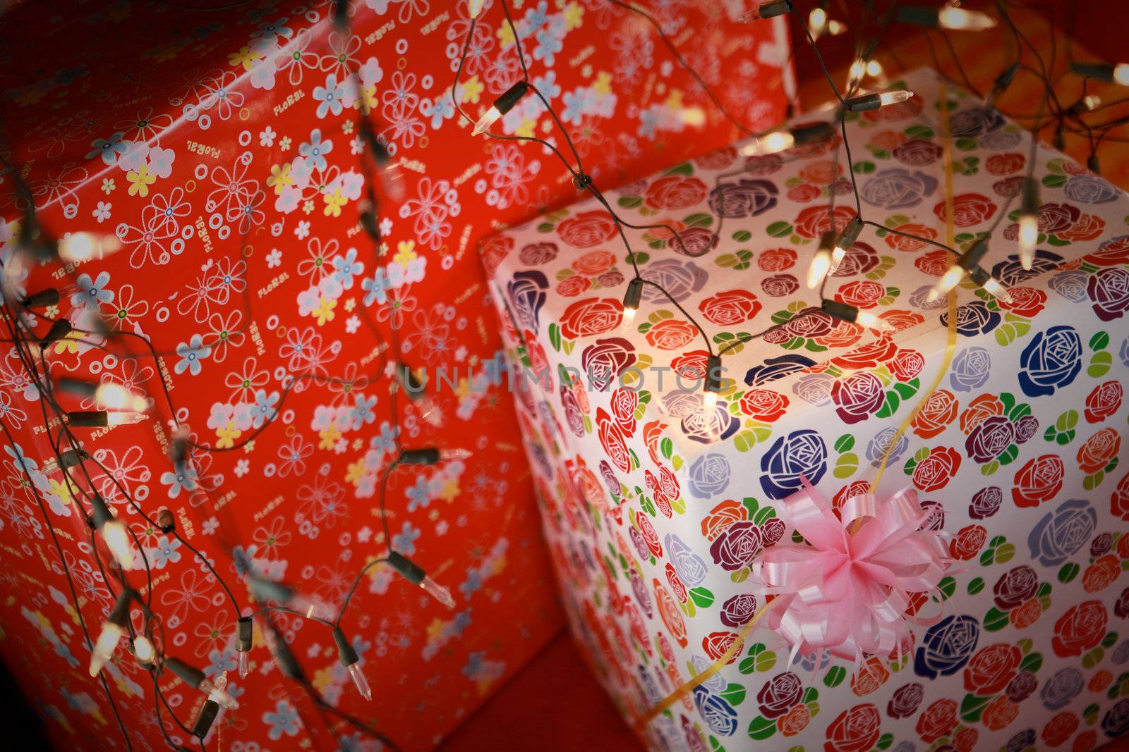 Boxed Christmas gifts under the tree.