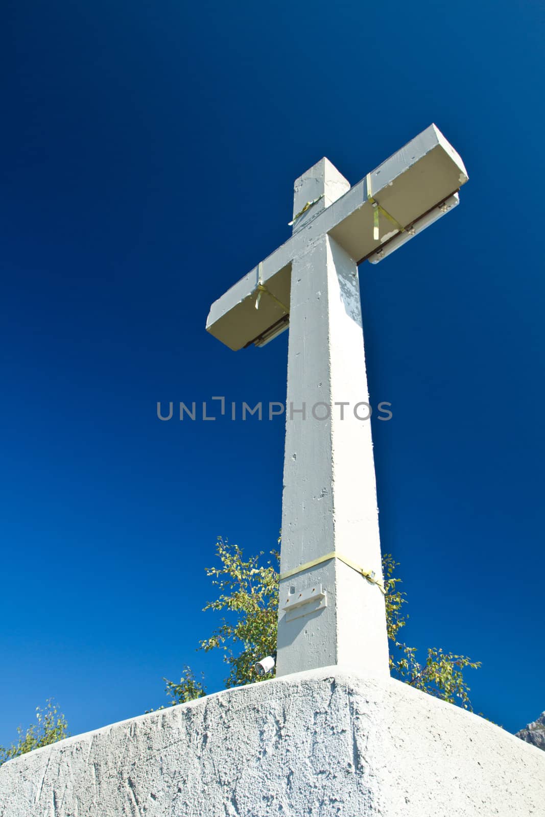 cross symbol on mountain summit