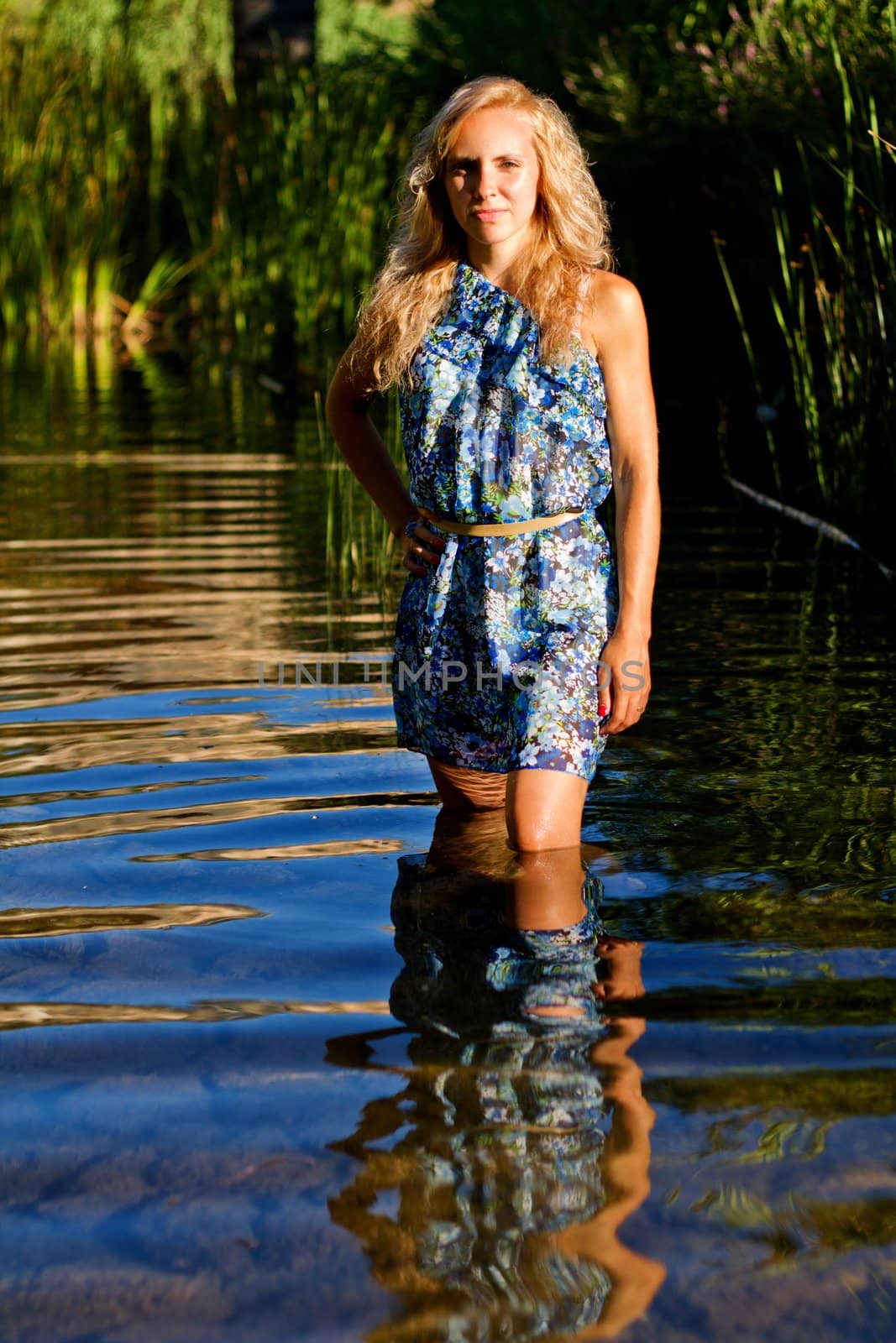 beautiful young girl on the river by membio