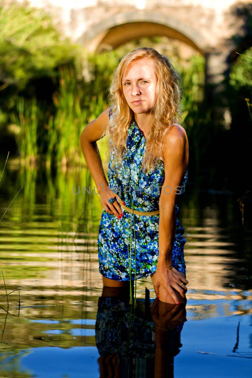 beautiful young girl on the river by membio