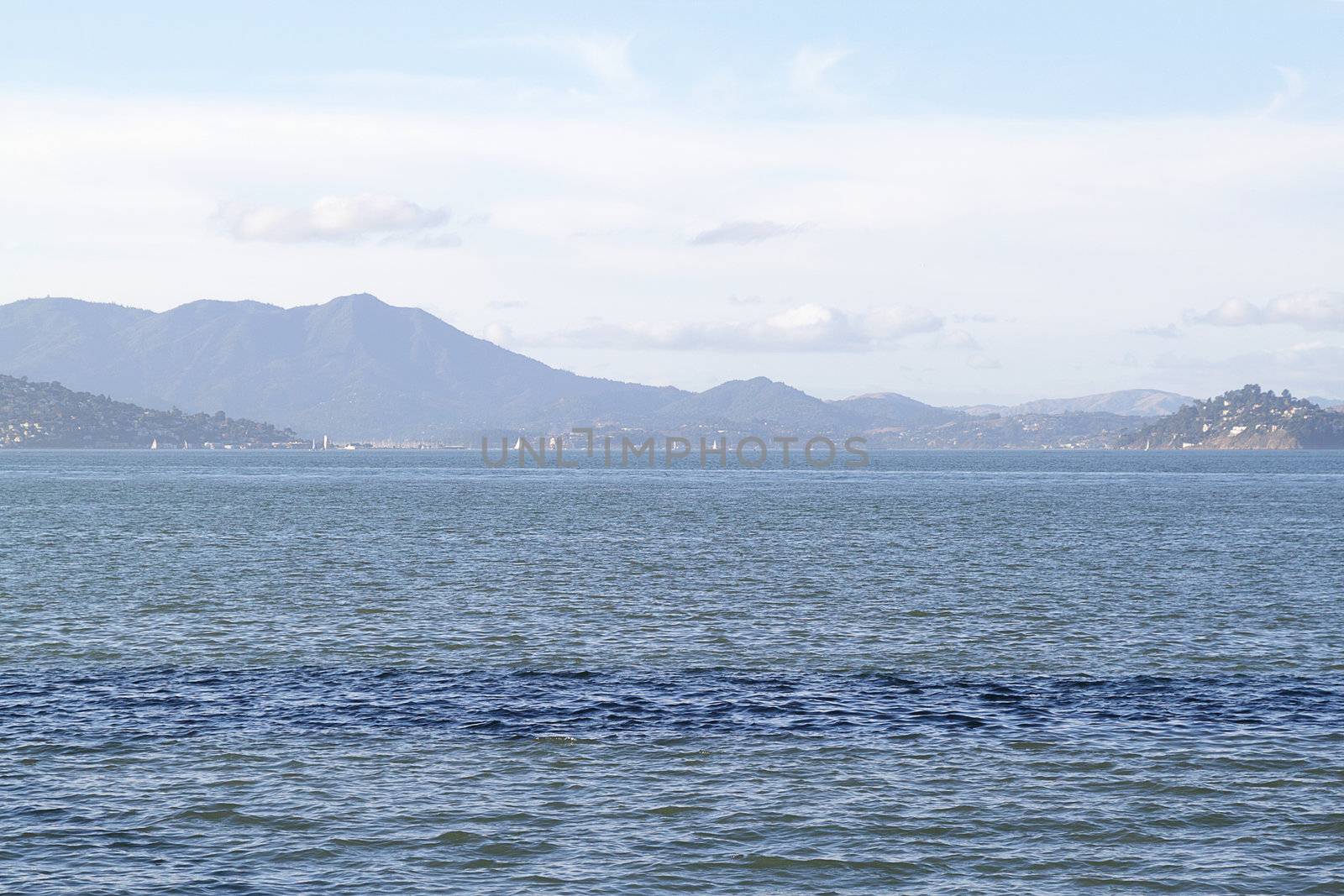 Seascape in San Francisco bay with mountains on background