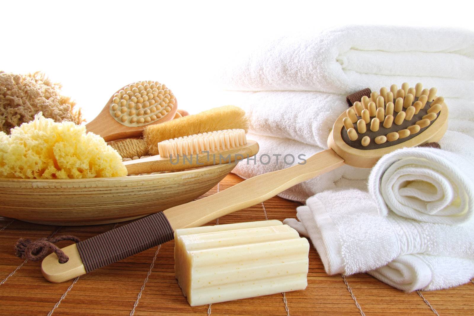 Spa still life of assorted bath brushes and sponges, soap towels by Sandralise