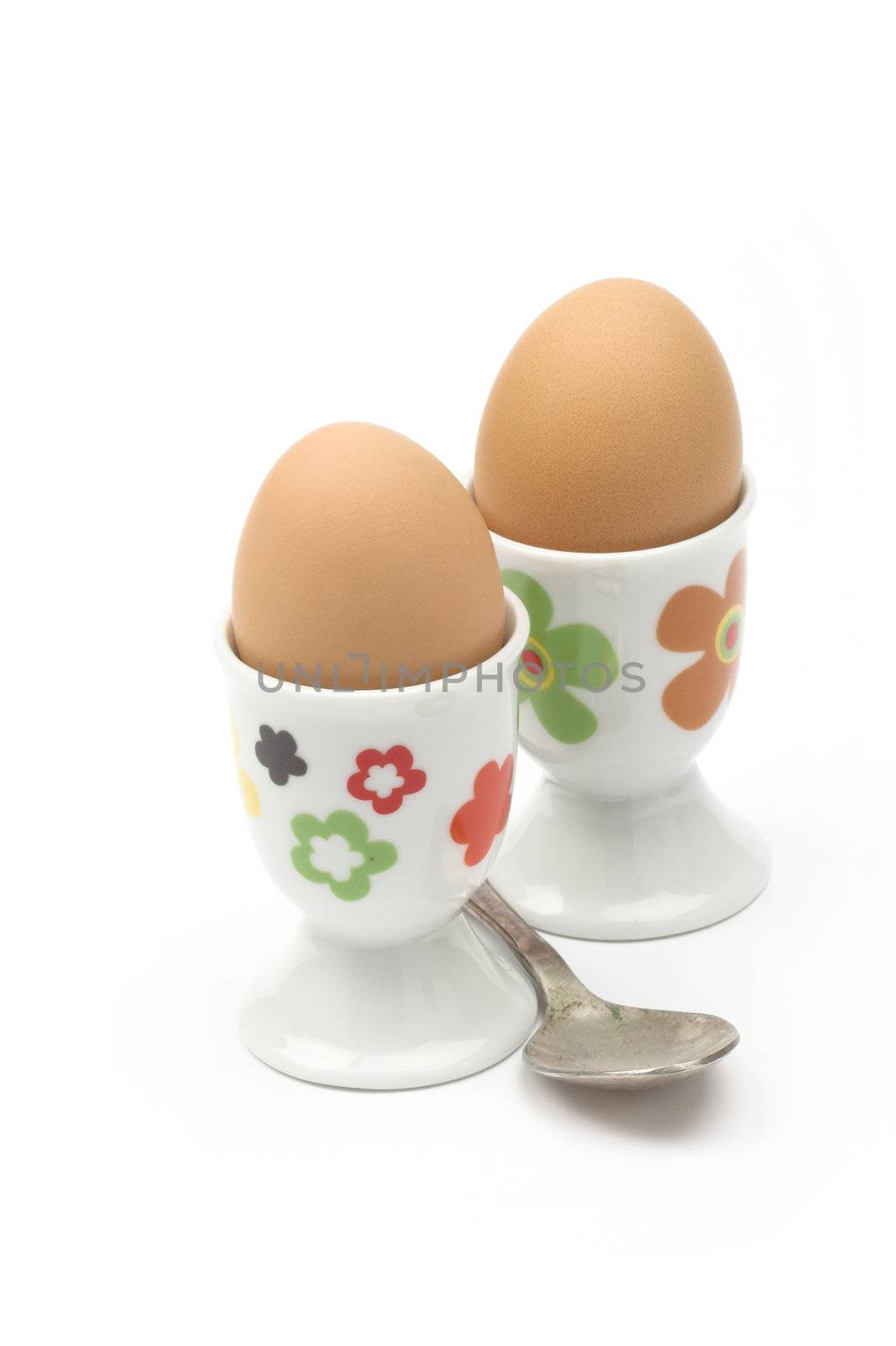 Boiled eggs in cups by alexkosev
