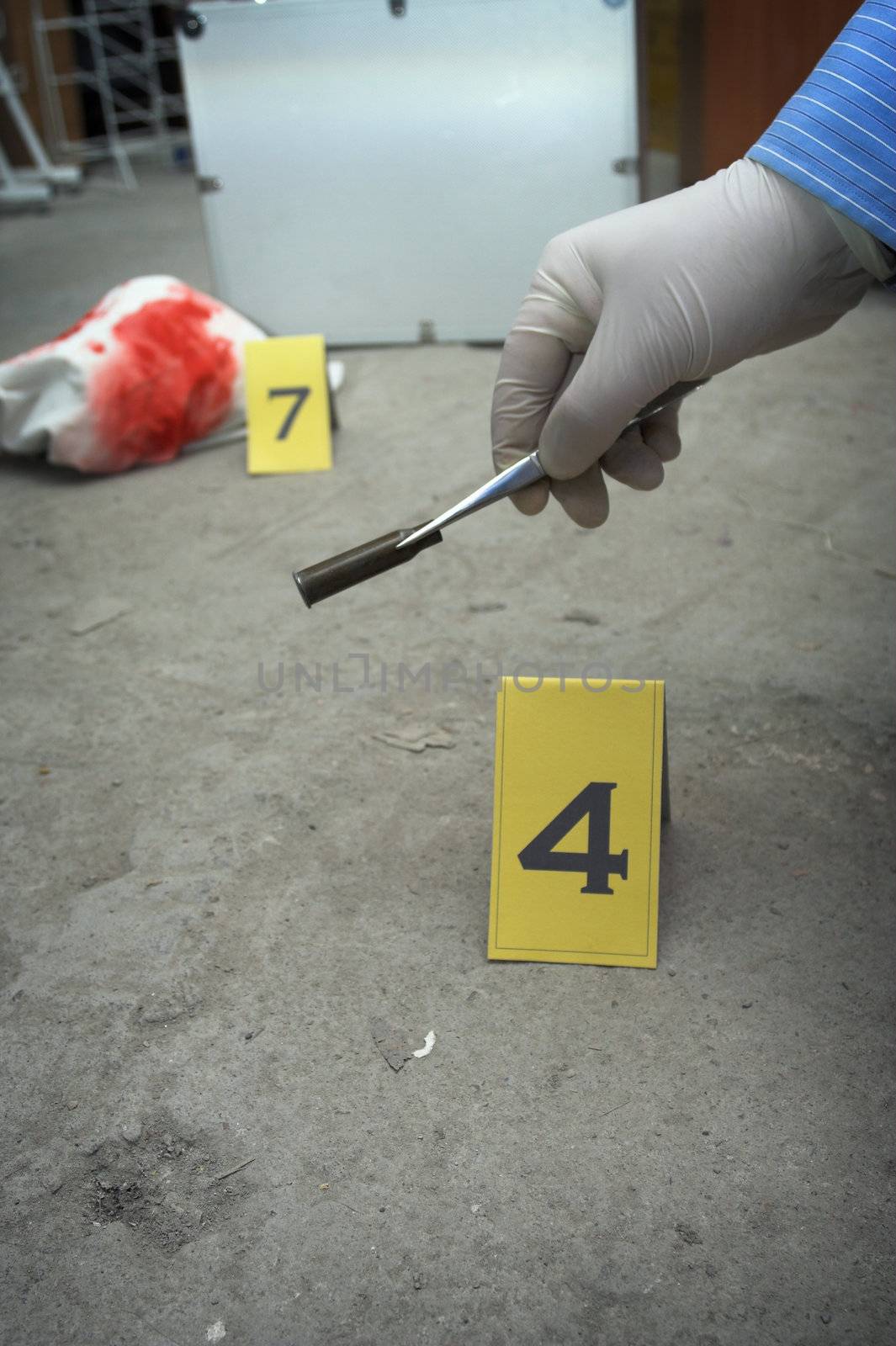 collect evidence-an investigator collect fired cartridge