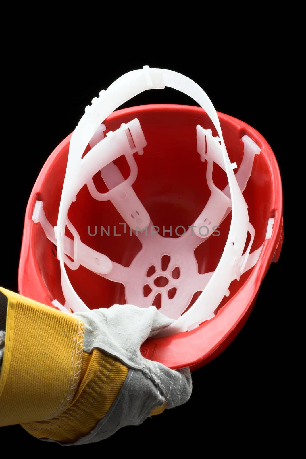 man holding red helmet over black
