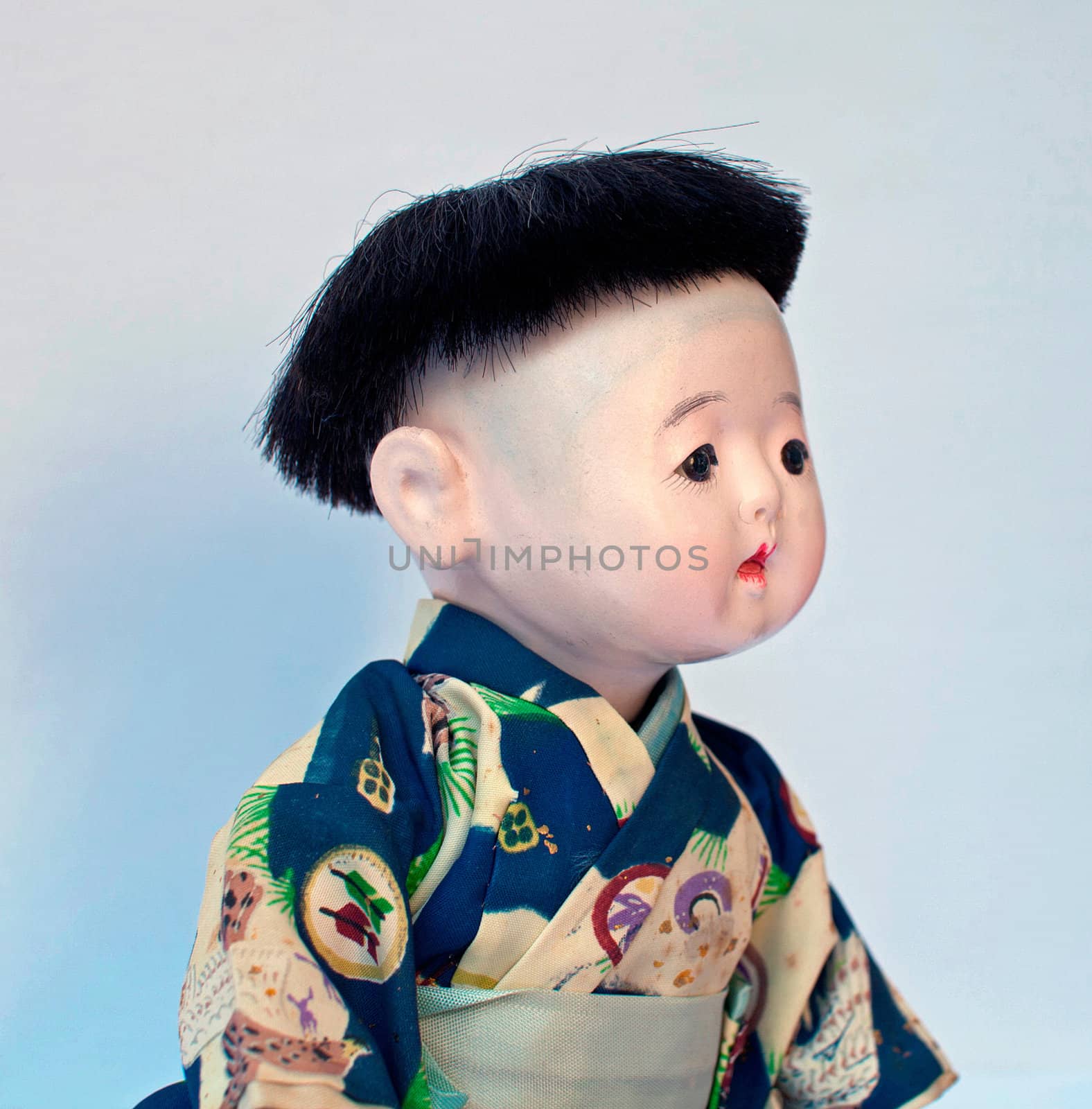 portrait of a japanese little boy. doll of collection of the years 1950/60.  
representation of past and nostalgia