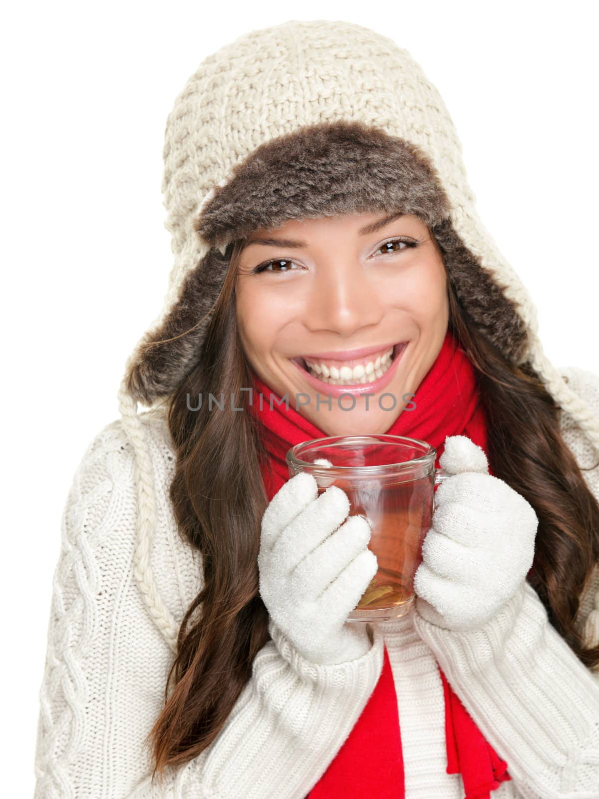 winter woman drinking tea wearing warm winter clothing, sweater, gloves and scarf. Beautiful mixed race asian caucasian girl model isolated on white background.